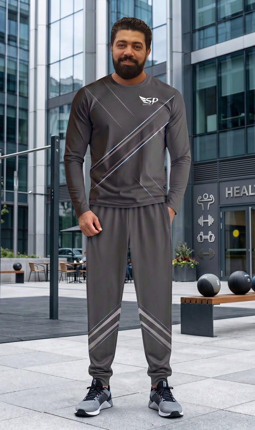 A man wearing a Sportify grey long-sleeve crew sweatshirt and matching jogger pants with reflective diagonal stripes.
