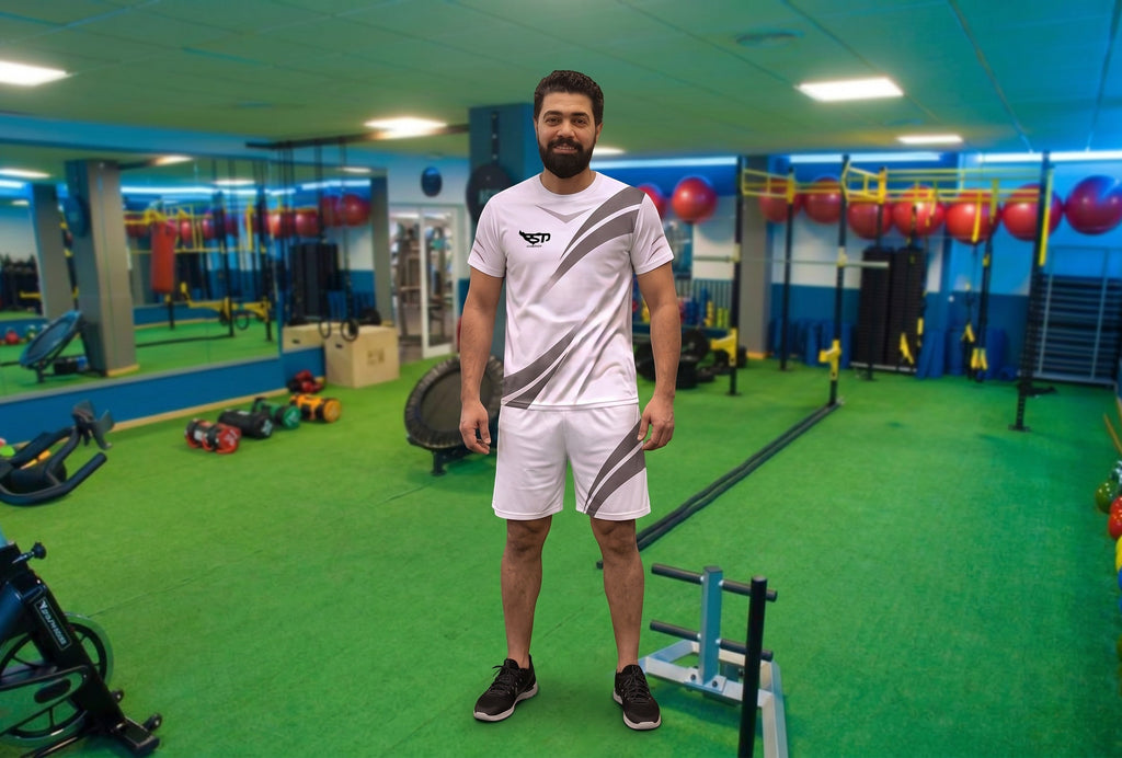 Sportify white athletic t-shirt and shorts set with reflective diagonal stripe detailing worn by a man in a gym